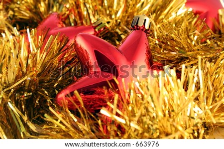 Red metallic Christmas stars and gold garland