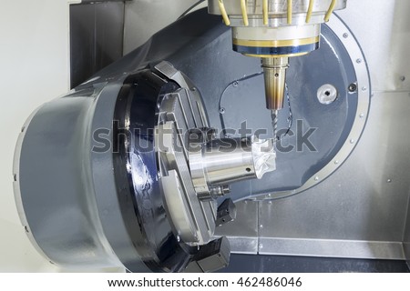 The 5-axis CNC machine while cutting the sample part of turbine.The spindle of 5 axis CNC machining center white cutting turbine sample part.