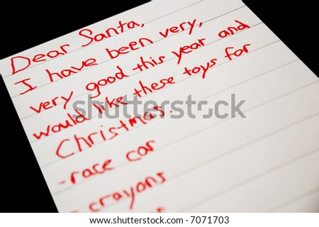 Christmas list written by a child -on black background