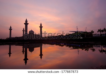 silhouette and mirror reflection on shah alam mosque