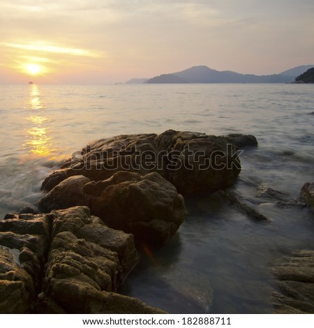 Long exposure sunset at the shore in Teluk Batik, Perak, Malaysia