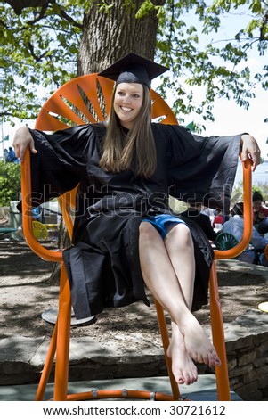 Wisconsin graduate celebrates commencement in an oversize chair at the student union