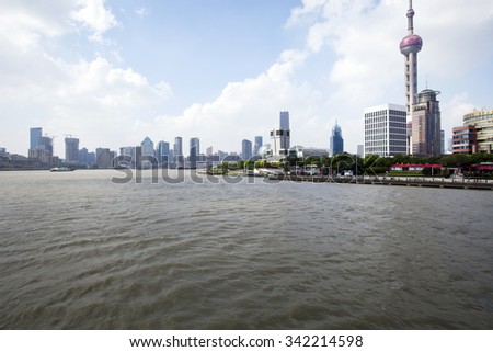 SHANGHAI, CHINA, JULY 25, 2015: The Pearl Tower and Pudong skyline with the river. China 2015
