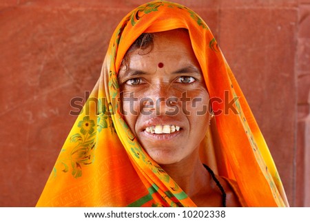 Old woman wearing a beautifully embroidered sari