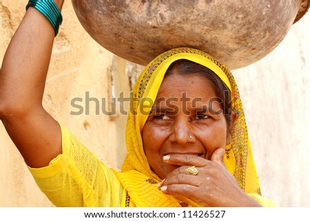 Woman wearing a yellow sari - India