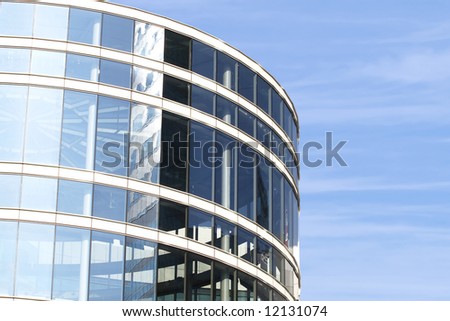Modern round building on blue sky background
