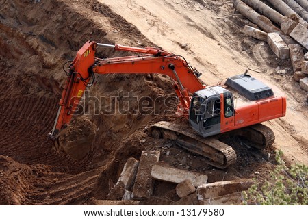 excavators at work. excavators at work. photo : Excavator at work; photo : Excavator at work