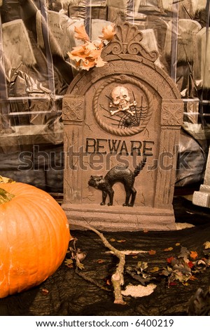 Creepy Halloween Graveyard Scene with Oak Leaves and Pumpkin
