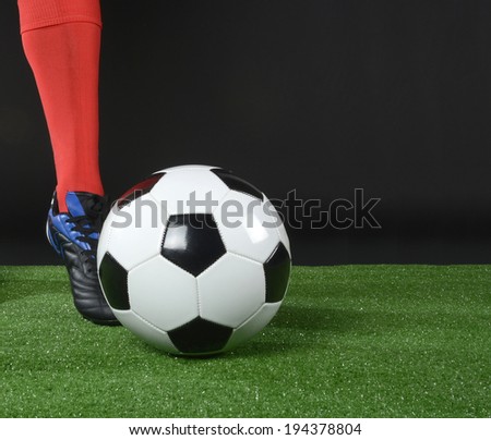Boot kicking the soccer ball