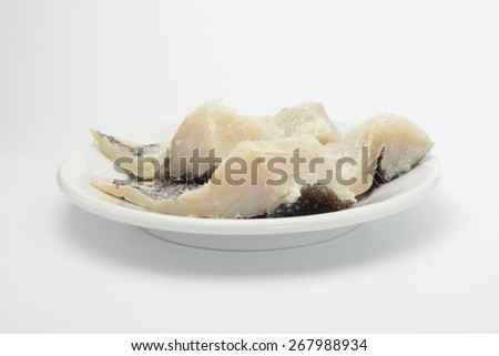 Dried and salted cod on a dish