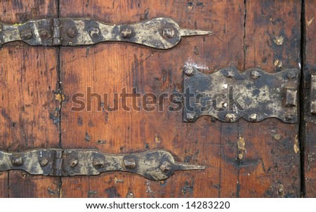 an old door with metal plates