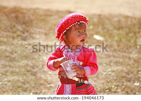 PETCHABUN, THAILAND - JANUARY 1 : Mong child with traditional clothes and silver jewelery in Mong hitt tribe minority village on January 1, 2014 in Petchabun, Thailand.