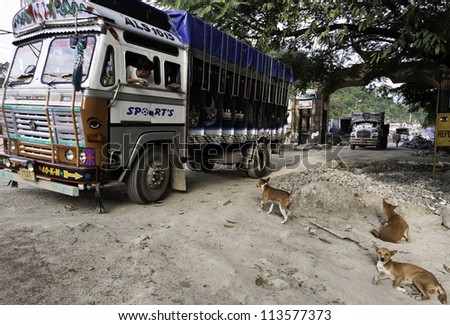BHALUKPONG - SEPTEMBER 14: Unidentified lorries cross the border between Arunachal Pradesh and Assam on September 14, 2011 at Bhalukpong, Assam, India.