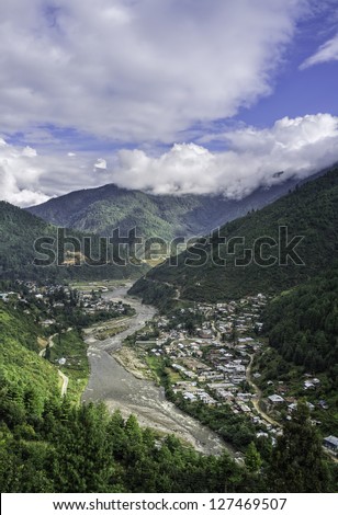 Dirang, Arunachal Pradesh, India. View of Dirang town and the Kameng River deep in the valley flanked by the high mountains of western Arunachal Pradesh in north east India.