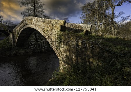 Glaisdale, Yorkshire, UK. Beggar\'s Bridge over the river Esk is an old 19th Century pack horse bridge near Glaisdale in the heart of the North York Moors National Park, Yorkshire, UK.