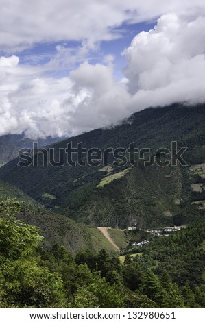 Tawang, Arunachal Pradesh, India. High mountains with small village in the deep valleys near the town of Dirang in Tawang district of western Arunachal Pradesh, north east India.