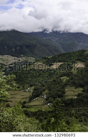 Tawang, Arunachal Pradesh, India. High mountains with small village in the deep valleys near the town of Dirang in Tawang district of western Arunachal Pradesh, north east India.