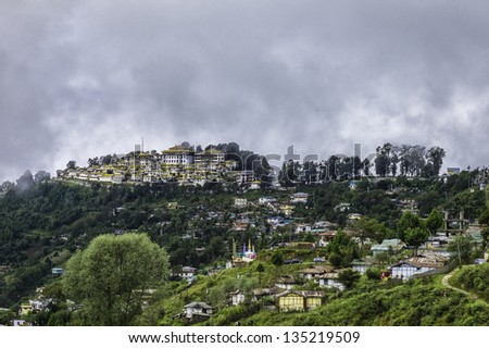 Tawang, Arunachal Pradesh, India. View of the 17th century Buddhist monastery perched high in the mountains over the the town of Tawang in western Arunachal Pradesh, north east India.