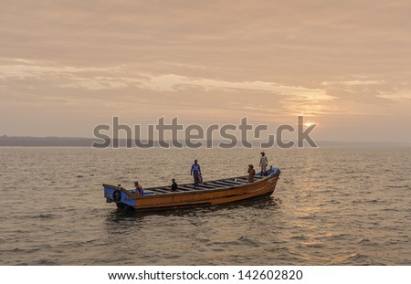 KANNUR, INDIA - DECEMBER 20:  deep sea fishermen set out in a traditional wooden boat on a fishing trip at dawn on December 20, 2011 from Mapilla Bay harbour, Kannur, Kerala, India.