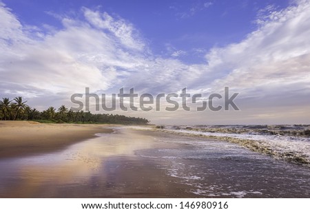 Kannur, Kerala, India. The sandy beach at Thottada, 10 km south of Kannur, at sunset and also the Arabian Sea along the Malabar Coast, Kerala, south India.