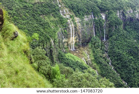 Shillong, Meghalaya, India. Seven Sisters waterfalls showing the high cliffs and mountainous region of Meghalaya state dominated by the Khasi Hills in north east India.
