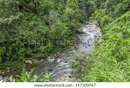 Shillong, Meghalaya, India. One of many rivers flowing through the Khasi Hills flanked by thick forests and deep valleys near Shillong, Meghalaya, north east India.