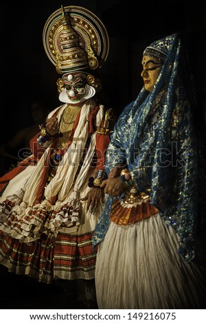KANNUR, INDIA - DECEMBER 07: Two traditional dancers perform Kathakali during an all-night performance at on December 07, 2011 at  Parassinikadavu Muthappan Temple near Kannur, Kerala, India.