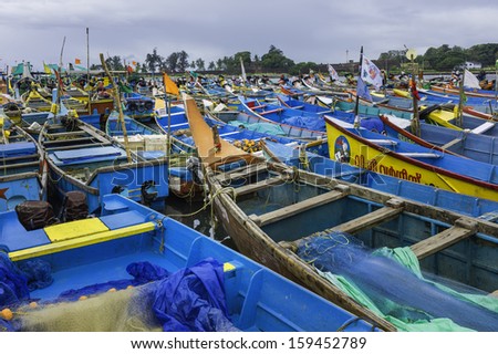 KANNUR, INDIA - NOVEMBER 27:  Fishing boats moored during inclement weather and storms at Mapilla Bay harbour on November 27, 2011 at Kannur, Kerala, India.