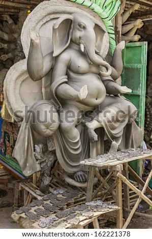 KOLKATA, INDIA - AUGUST 19: A Lord Ganesha figure being fashioned from locally dredged clay and sand for the Hindu Durga Puja festival on August 19, 2011 in Kolkata, India.