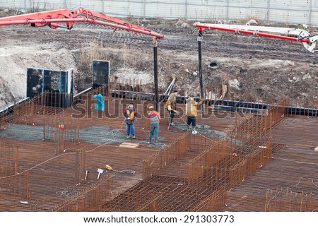 Construction of the building. Pouring the concrete foundation slab foundation. The concrete base slab foundation under the building. Stages of construction of the building. Foundation plate and