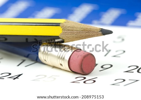 calendar and a sharp blue lead pencil