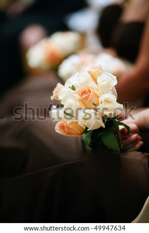 girl holding elegant rose bouquet, wedding ceremony