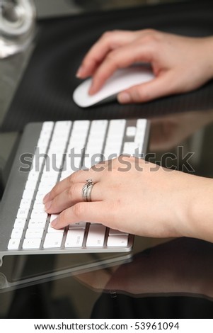 one person working on the computer, close-up image