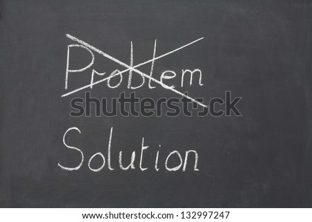 Problem or Solution  choice written on an old school blackboard.