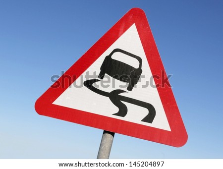 Road sign warning of slippery conditions.