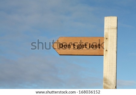 Wooden footpath sign with message 'Don't get lost.'