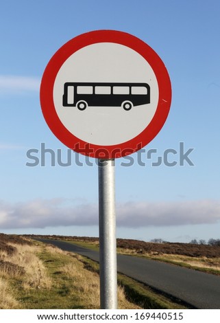 Unsuitable for buses sign on a narrow moorland road.