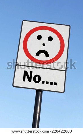 No written on a road sign with a frowning face