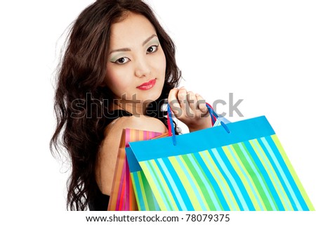 stock photo Asian young woman in skirt with shopping bags 