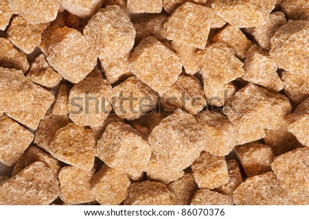Cubes of brown whole cane sugar,  texture