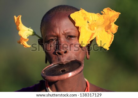 SOUTH OMO ETHIOPIA OCTOBER 15 Unidentified Suri woman at a ceremony on October 15 2012 in South Omo Ethiopia A 5-year resettlement program started 2011 threatens tribes in Ethiopia SOUTH OMO ETHIOPIA OCTOBER 15 Unidentified Suri woman at a ceremony on October 15 2012 in South Omo Ethiopia A 5-year resettlement program started 2011 threatens tribes in Ethiopia