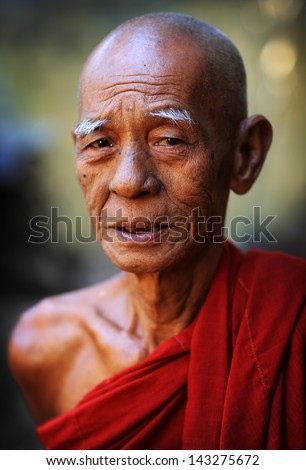 Mandalay - Myanmar - December 11, 2012: An Unidentified Burmese Buddhist Monk On December 11, 2012 In Mandalay, Myanmar. In 2012 An Ongoing Conflict Started Between Buddhists And Muslims In Myanmar.