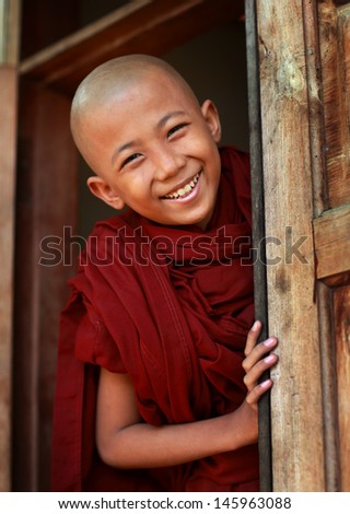 MANDALAY - MYANMAR - DECEMBER 8: An unidentified Burmese Buddhist novice on December 8, 2012 in Mandalay, Myanmar. In 2012 an ongoing conflict started between Buddhists and Muslims in Myanmar.