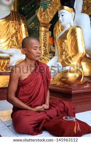 YANGON - MYANMAR - DECEMBER 1: An unidentified Burmese monk on December 1, 2013 in Yangon, Myanmar. In 2012 an ongoing conflict started between Buddhists and Muslims in Myanmar.