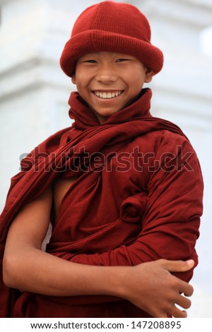 NYAUNGSHWE - MYANMAR - DECEMBER 25: Unidentified Burmese Buddhist novice on December 25, 2012 in Nyaungshwe, Myanmar. In 2012 an ongoing conflict started between Buddhists and Muslims in Myanmar