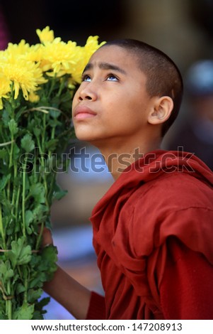 SAGAING - MYANMAR - DECEMBER 13: An unidentified Burmese Buddhist novice on December 13, 2012 in Sagaing, Myanmar. In 2012 an ongoing conflict started between Buddhists and Muslims in Myanmar.