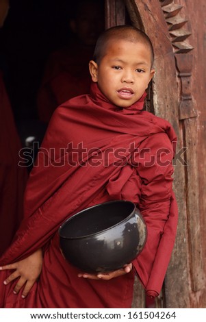 NYAUNGSHWE - MYANMAR - DECEMBER 18, 2012: Unidentified Burmese Buddhist monk on December 18, 2012 in Nyaungshwe, Myanmar. In 2012 an ongoing conflict started between Buddhists and Muslims in Myanmar