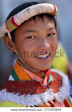 LEH - INDIA - SEPTEMBER 20, 2013: Unidentified young man with traditional dress at the inaugural procession of the annual Ladakh Festival 2013 on September 20, 2013 in Leh, India.