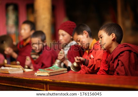 LAMAYURU - INDIA - SEPTEMBER 18, 2013: Unidentified Buddhist novices attending the famous 3-days annual Mahakala Puja in Lamayuru monastery (Ladakh) on September 18, 2013 in Lamayuru, India.