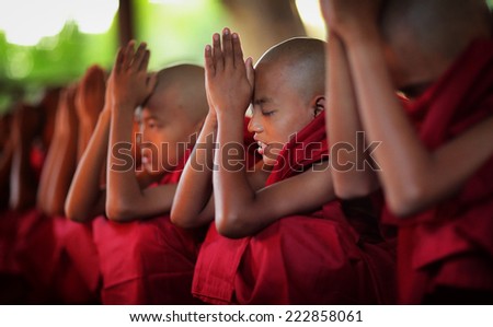 BAGAN - MYANMAR - DECEMBER 11, 2013: Unidentified Burmese novices on December 11, 2013 in Bagan, Myanmar. In 2012 an ongoing conflict started between Buddhists and Muslims in Myanmar.